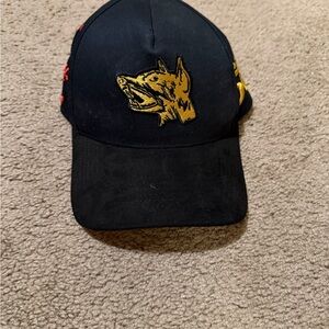 Embroidered Black Cap with Gold Wolf Design